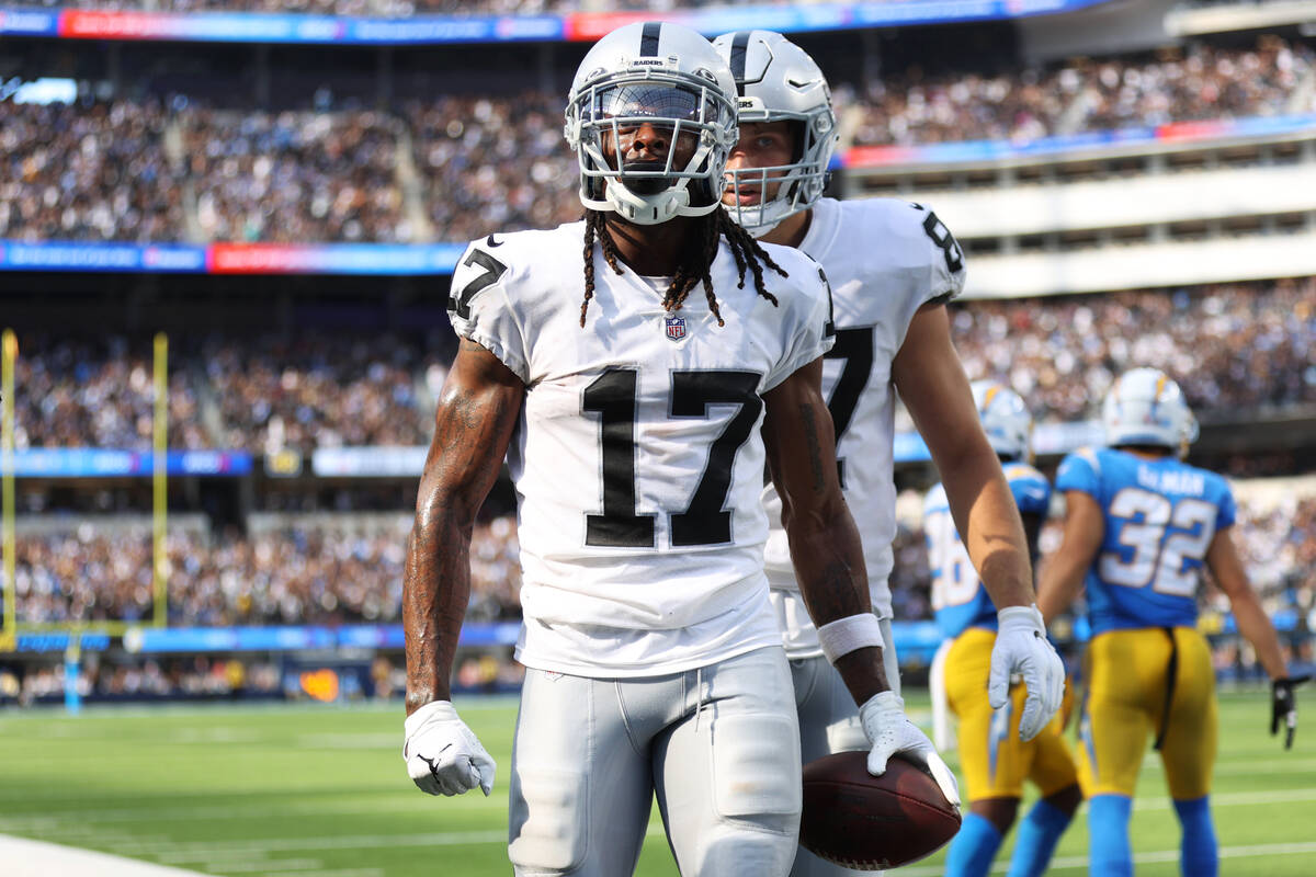 Raiders wide receiver Davante Adams (17) reacts after scoring a touchdown catch during the seco ...
