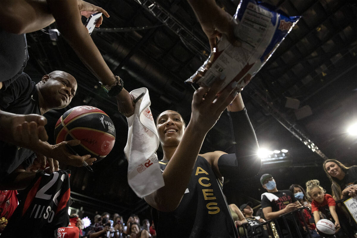 Las Vegas Aces forward A'ja Wilson (22) signs autographs for fans after winning Game 2 of a WNB ...