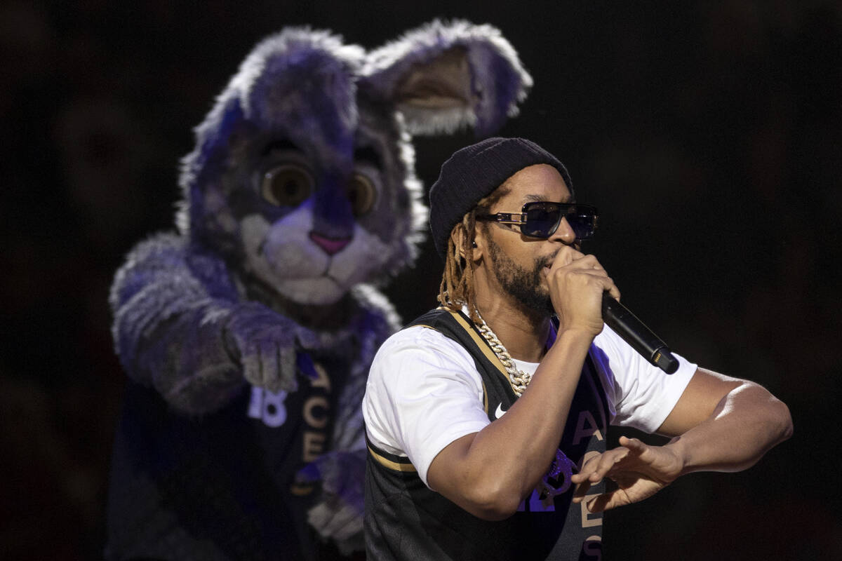 Lil John performs with the Las Vegas Aces mascot dancing in the background during halftime in G ...