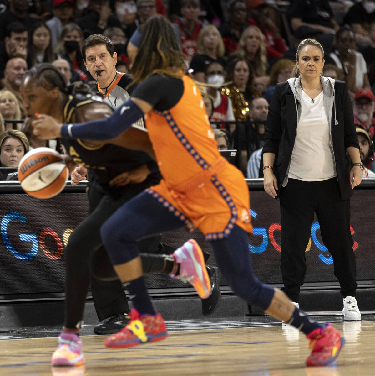 Las Vegas Aces head coach Becky Hammon watches as guard Chelsea Gray (12) drives around Connec ...