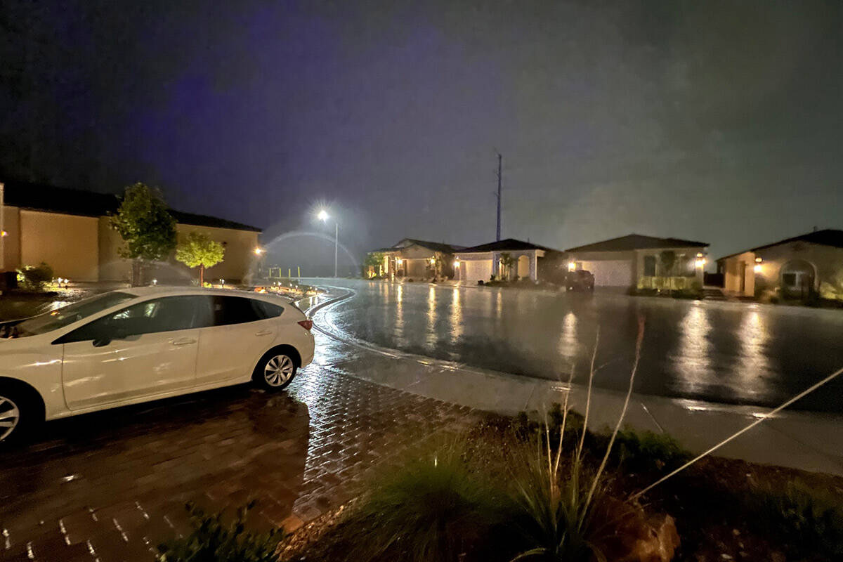 Water rolls down the street in a neighborhood in Skye Canyon on Sept. 13, 2022. (Marian Green/L ...