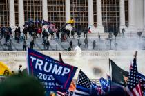 Supporters of US President Donald Trump clash with the US Capitol police during a riot at the U ...