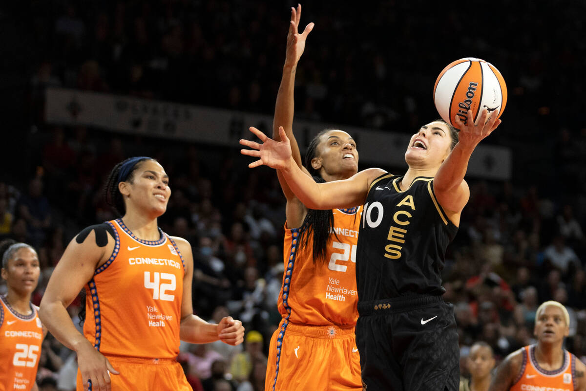 Las Vegas Aces guard Kelsey Plum (10) shoots against Connecticut Sun forward DeWanna Bonner (24 ...