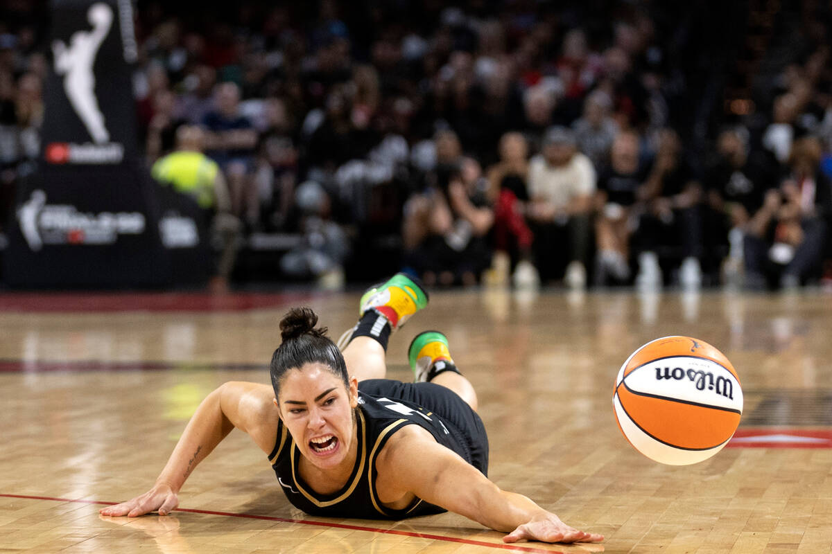 Las Vegas Aces guard Kelsey Plum (10) dives for the ball during the second half in Game 2 of a ...