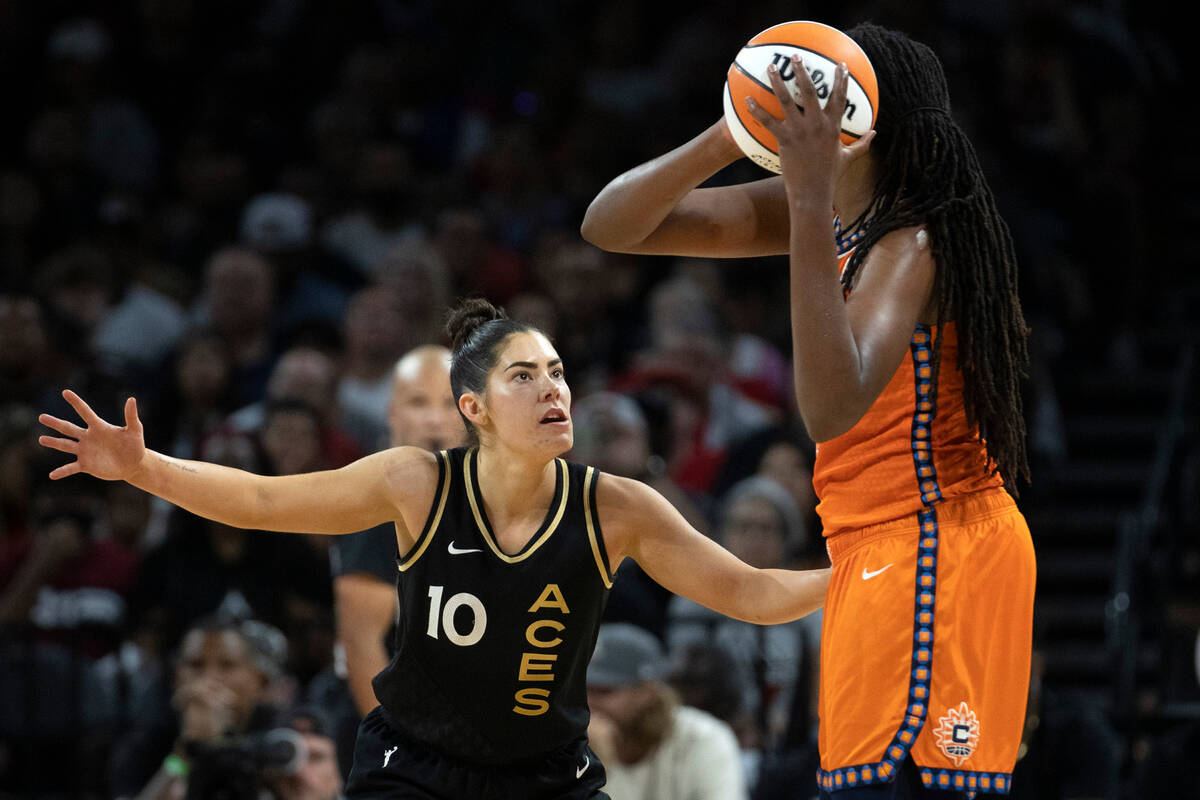 Las Vegas Aces guard Kelsey Plum (10) defends against Connecticut Sun forward Jonquel Jones (35 ...