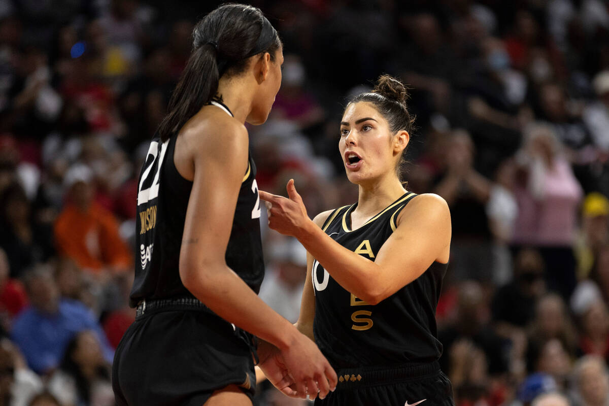 Las Vegas Aces guard Kelsey Plum (10) communicates with forward A'ja Wilson (22) during the fir ...