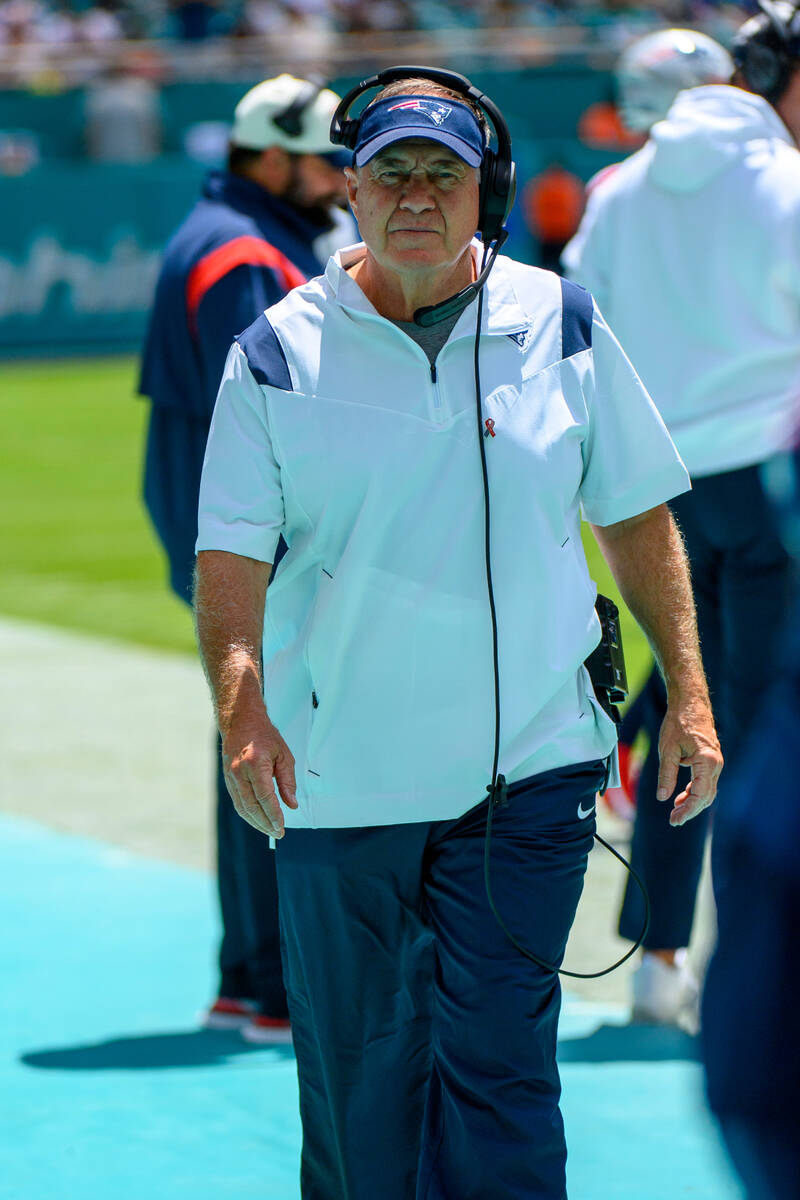 New England Patriots head coach Bill Belichick walks on the sidelines during an NFL football ga ...