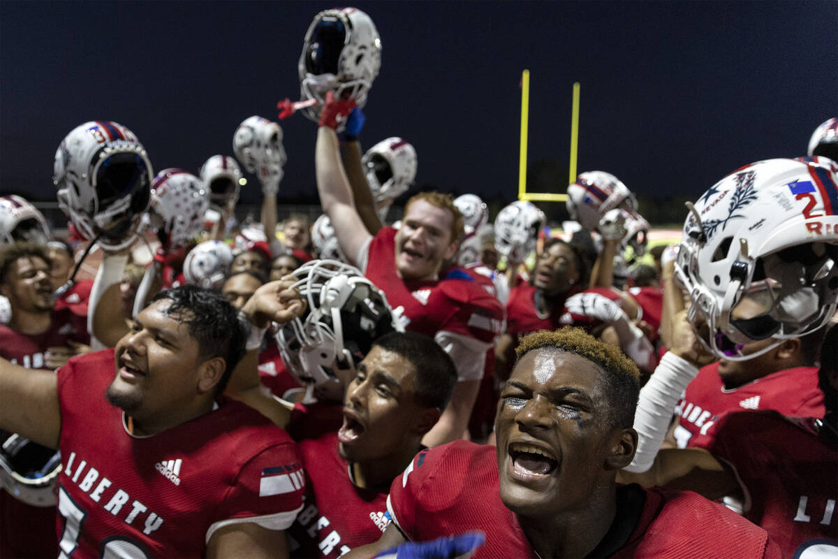 Liberty players go crazy with their student section after winning their Class 5A high school fo ...