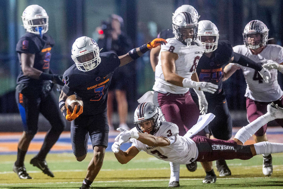 Bishop Gorman running back Devon Rice (3) breaks into open field after missed tackle by Hamilto ...