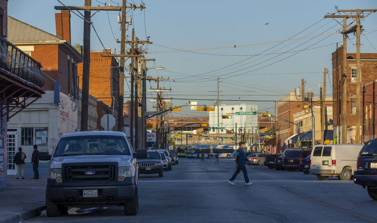 Pedestrians move about as daylight comes along on East Sixth Avenue on Friday, Sept. 16, 2022, ...