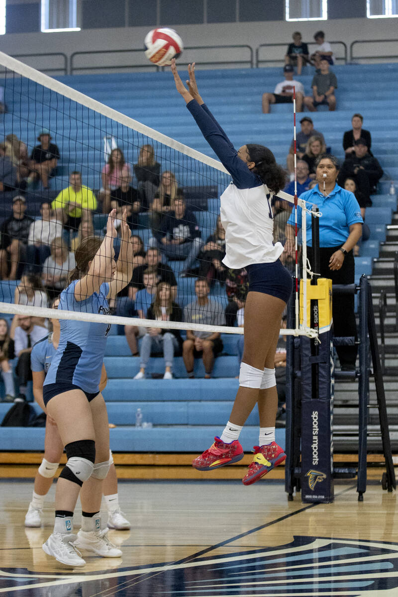 Shadow Ridge's Makaila Brooks (11) makes a hit during their match against Foothill High School ...