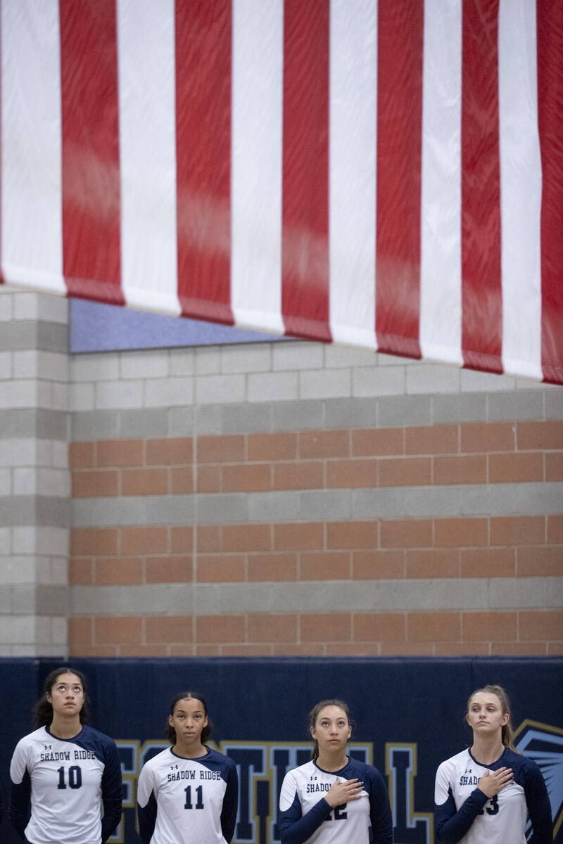 Shadow Ridge players listen to the national anthem before facing off against Foothill High Scho ...