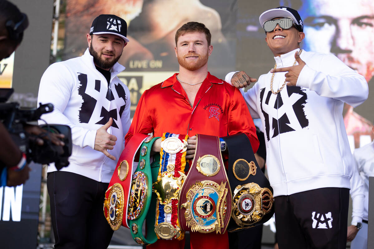 Saul "Canelo" Alvarez, center, poses during a ceremonial weigh-in at Toshiba Plaza in ...