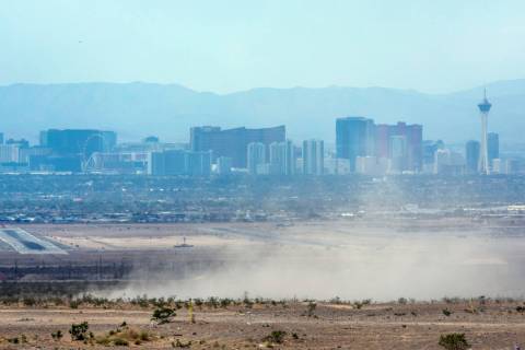 Dust kicks up north of Nellis AFB as the Clark County Department of Environment and Sustainabil ...