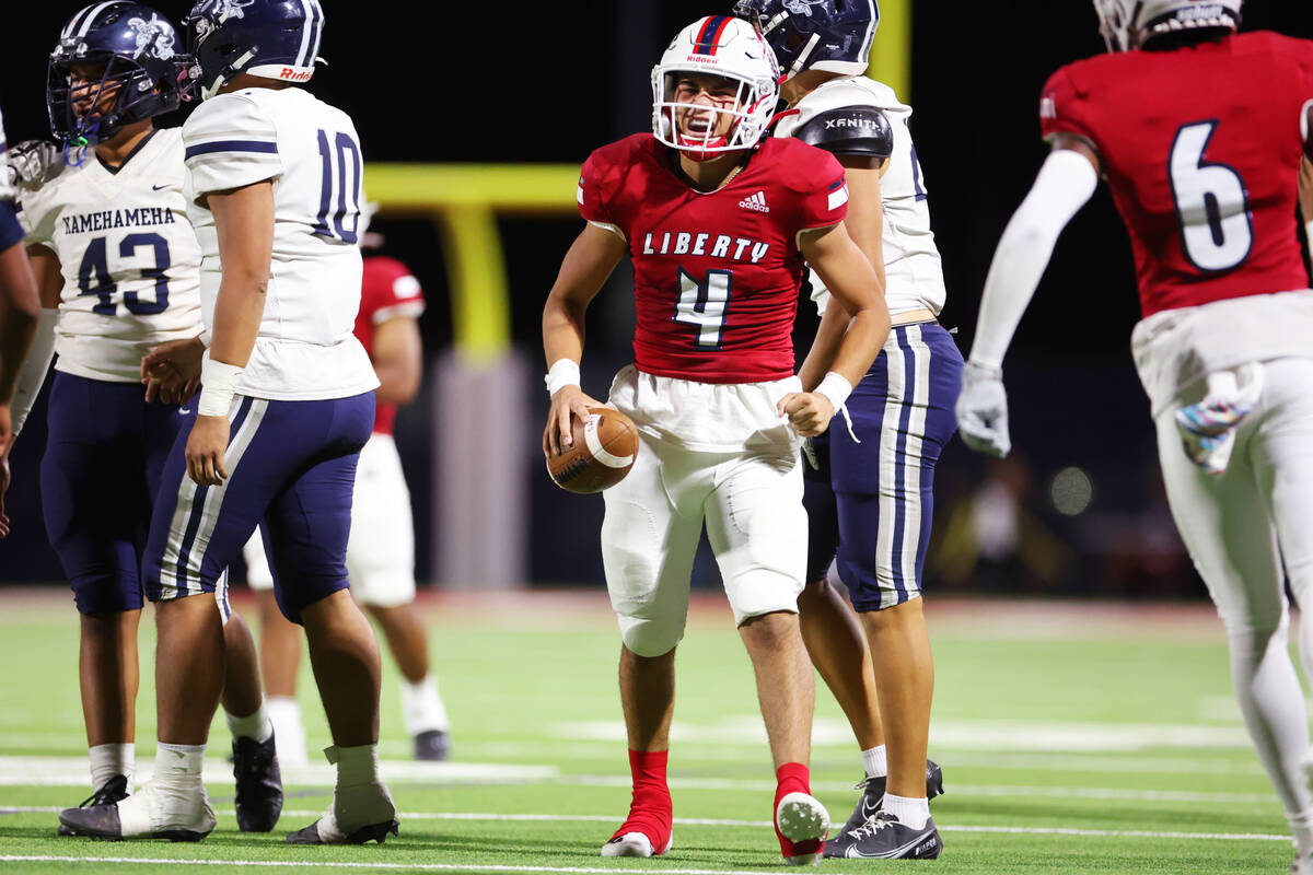 Liberty's Colin Gregorio (4) reacts after running the ball against Kamehameha Kapalama in the s ...