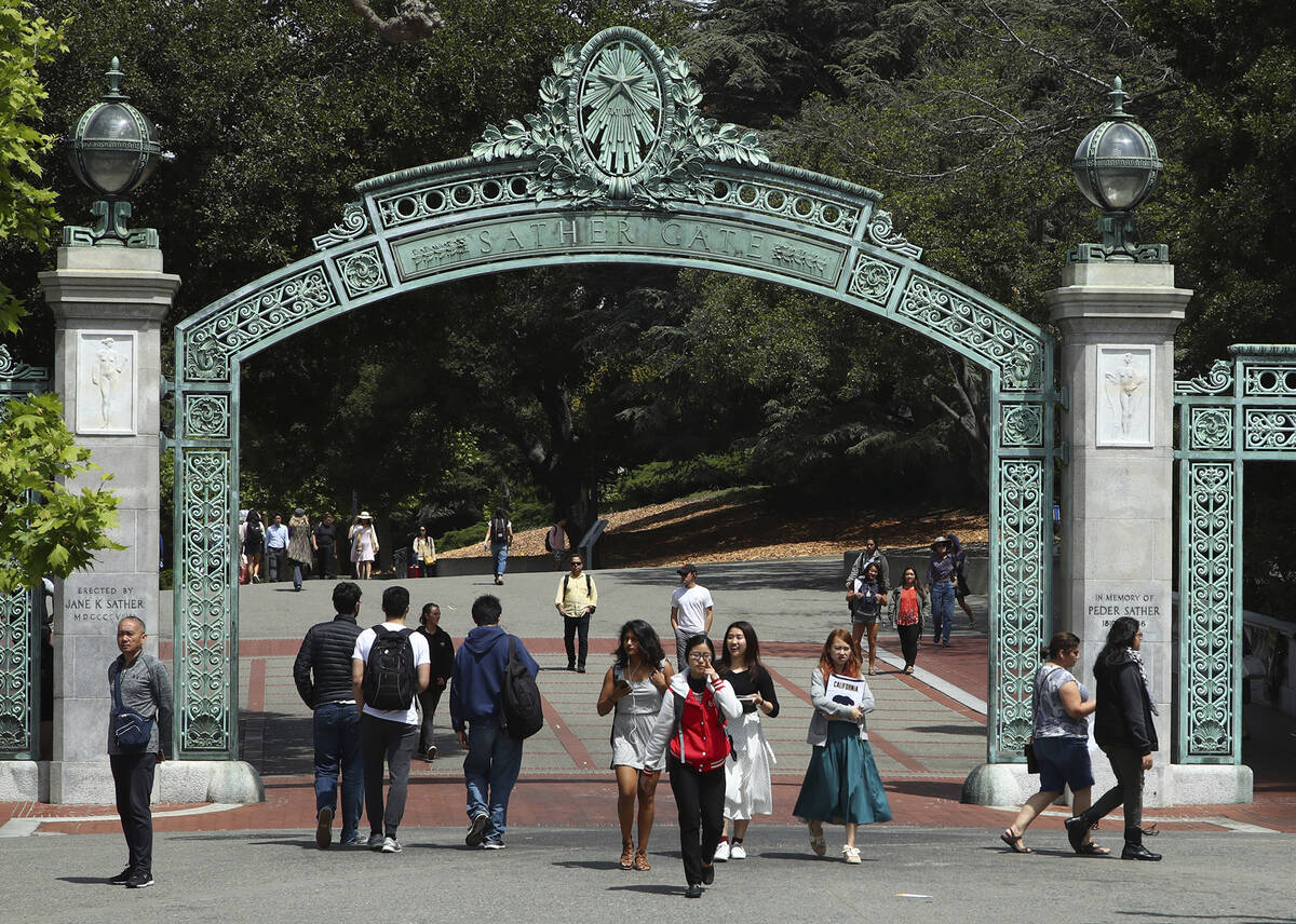FILE - Students walk past Sather Gate on the University of California at Berkeley campus on May ...