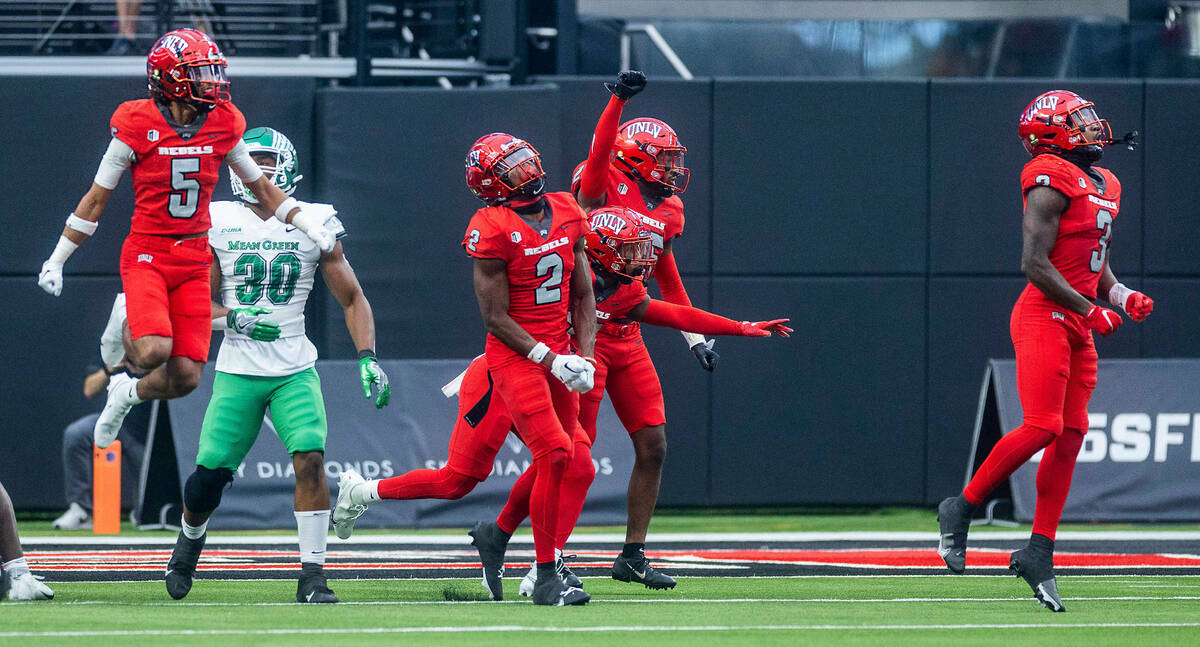 UNLV Rebels defenders celebrate another fourth down stop over the North Texas Mean Green offens ...