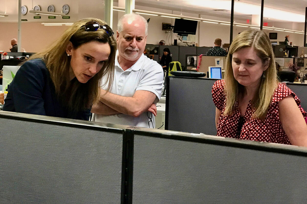 From left, Karisa King, Jeff German and Carri Geer Thevenot confer in the Review-Journal newsro ...