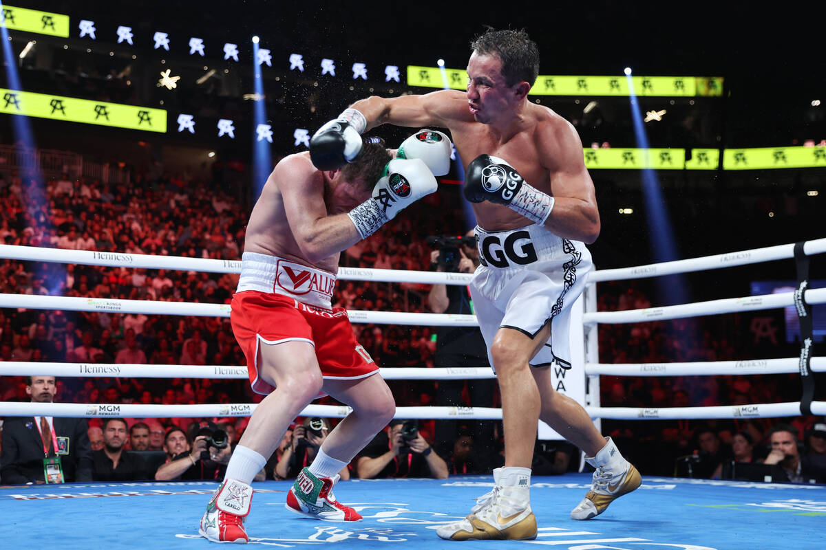 Saul "Canelo" Alvarez, left, defends a punch against Gennadiy "GGG" Golovki ...