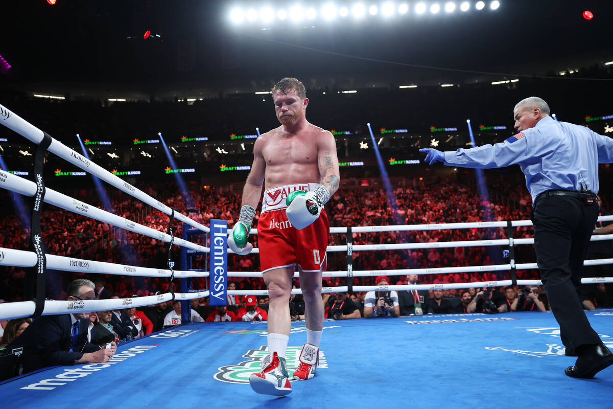 Saul "Canelo" Alvarez, left, is directed to a corner during the ninth round of a supe ...