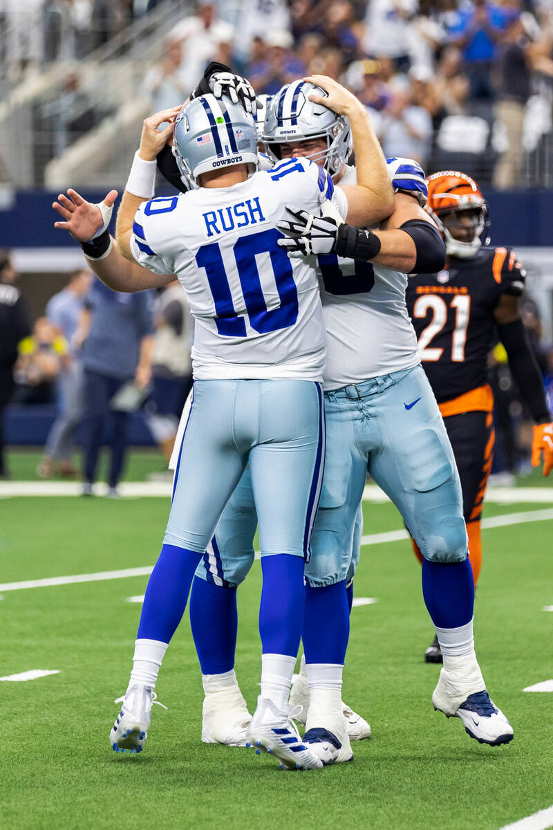 Dallas Cowboys quarterback Cooper Rush (10) celebrates a touchdown pass with guard Zack Martin ...