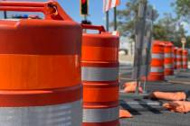 Road construction sign and barrels line Polaris Avenue on Aug. 26, 2022. (Mick Akers/Las Vegas ...