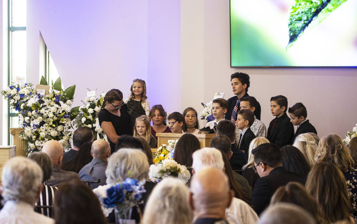 Family members recite a hymn during a funeral service for Las Vegas City Councilman Steve Ross ...