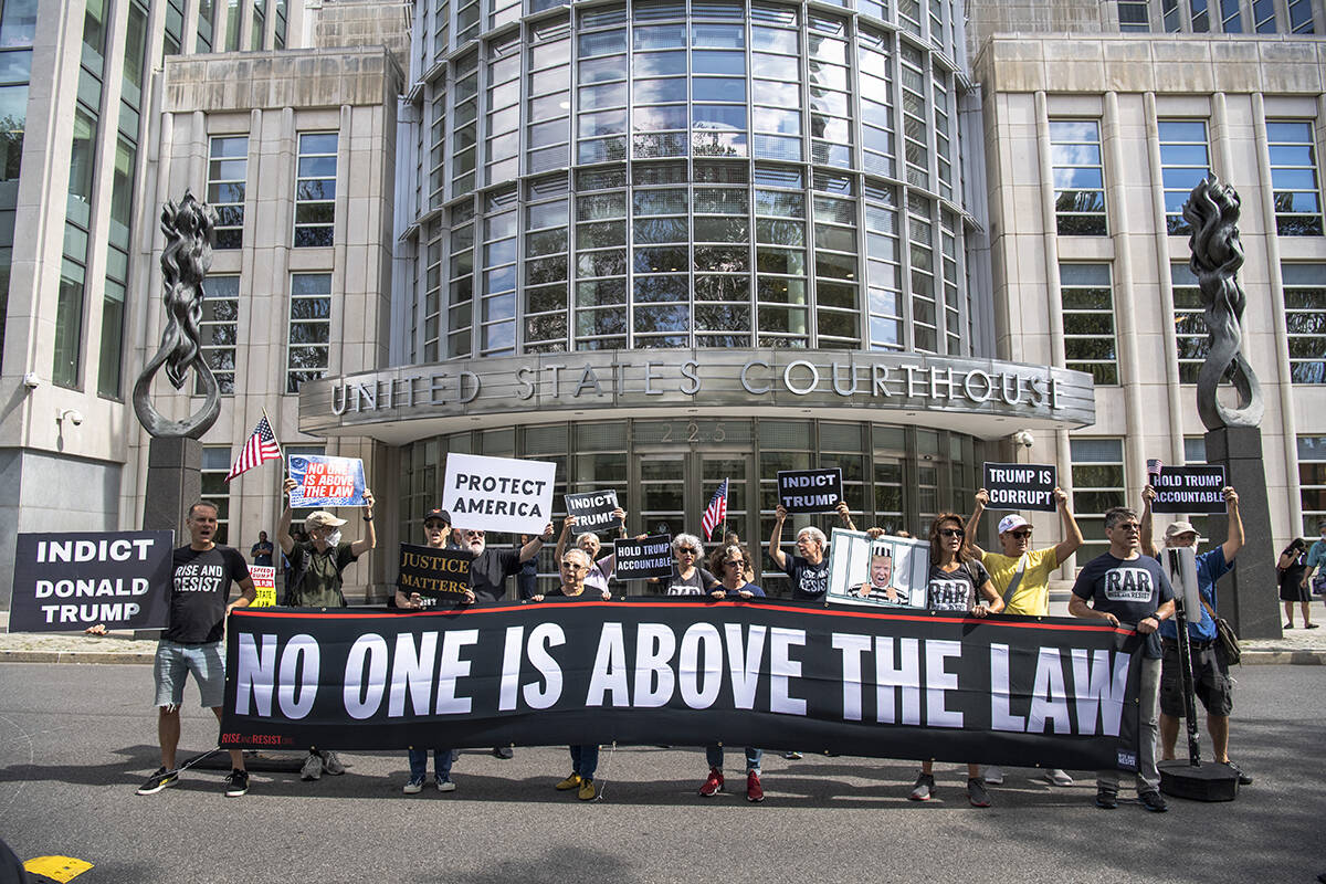 People protest about Donald Trump's lawyers chanting 'No one is above the law' outside of Brook ...