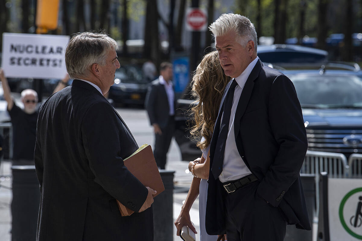 (Left to right) Donald Trump's attorneys James Trusty and Evan Corcoran arrive at Brooklyn Fede ...