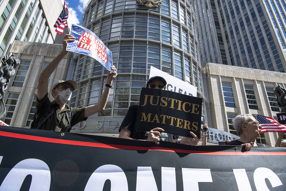 People protest about Donald Trump's lawyers chanting 'No one is above the law' outside of Brook ...