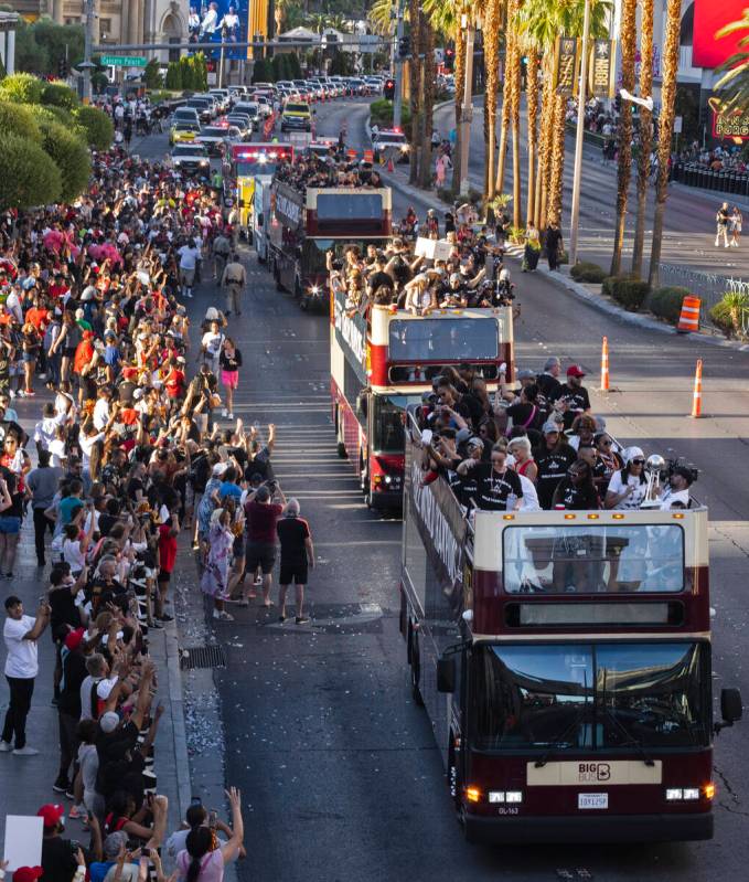 Fans watch as the Las Vegas Aces pass by during the team's WNBA Championship victory parade on ...