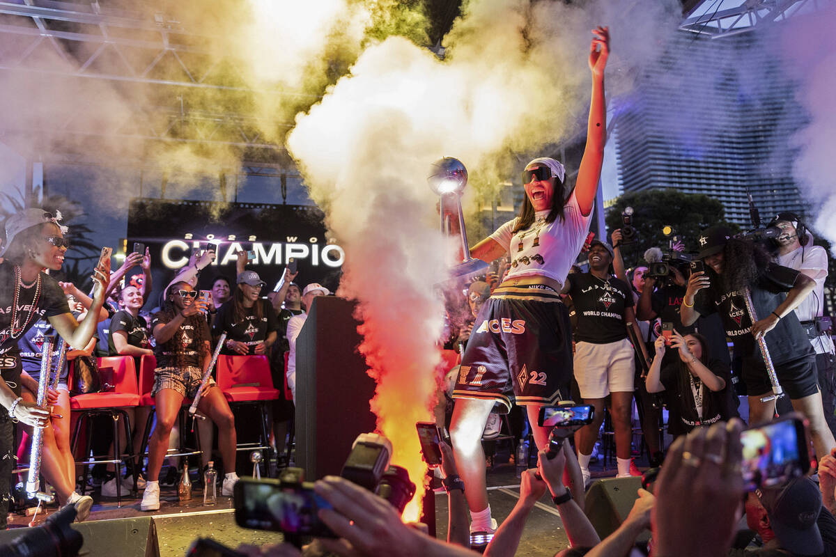 Las Vegas Aces forward and 2022 WNBA MVP A'ja Wilson, holding the 2022 WNBA Championship trophy ...