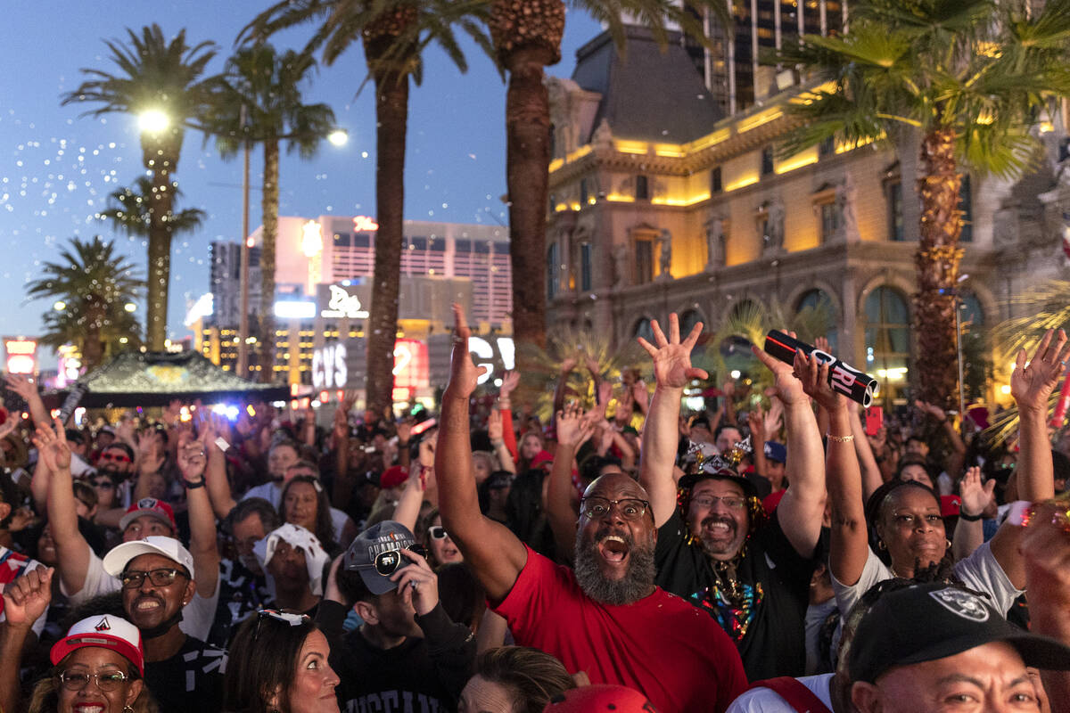 Las Vegas Aces fans cheer for their team during a parade to celebrate the Aces’ 2022 WNB ...