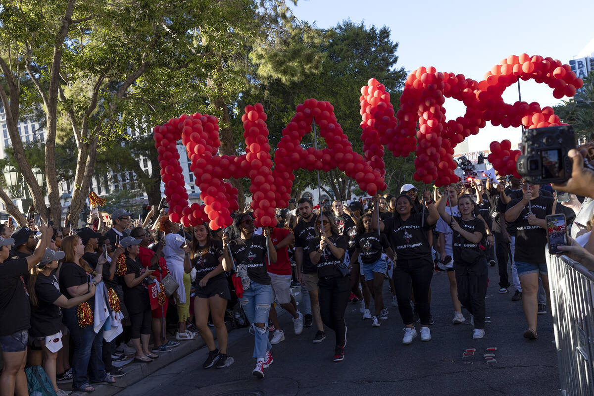 A parade moves down Las Vegas Boulevard in honor of the Las Vegas Aces winning the 2022 WNBA Ch ...