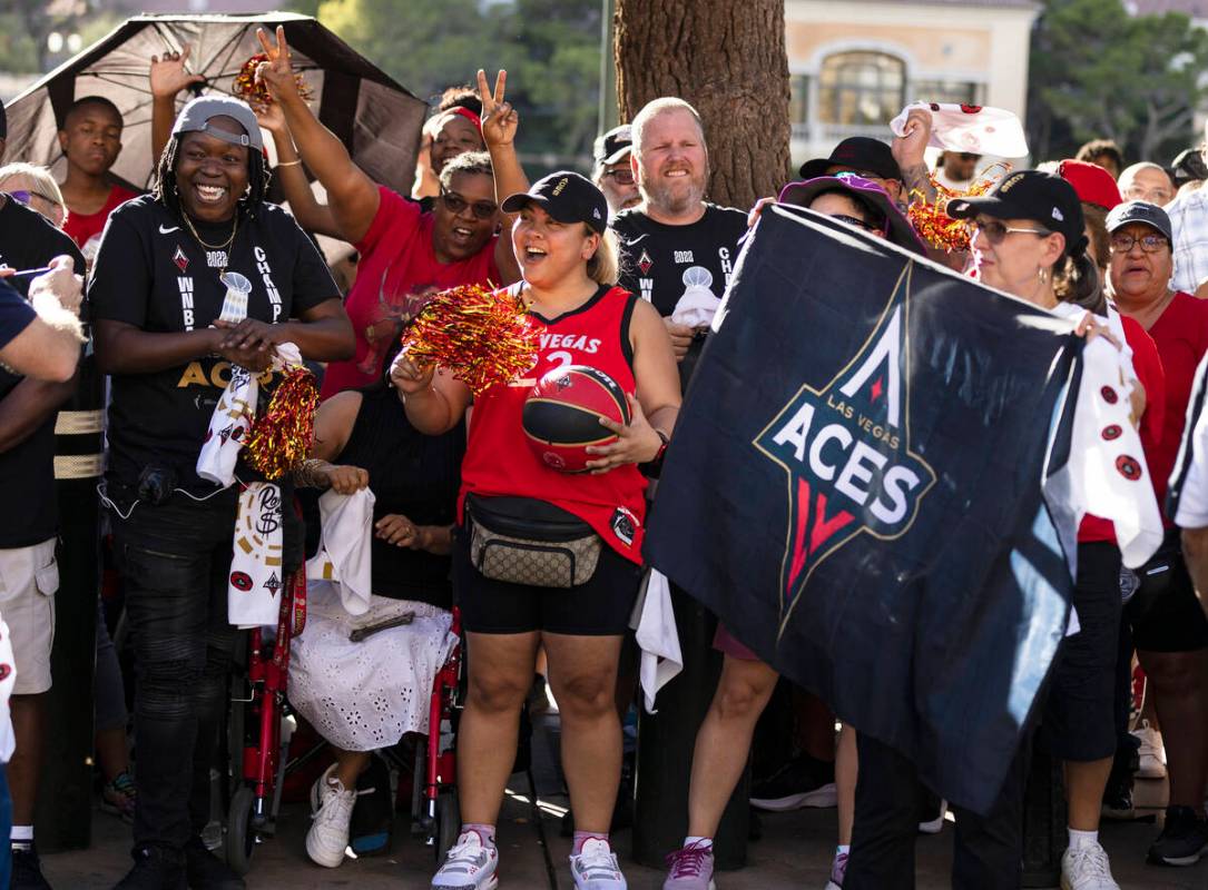 Fans wait to watch the Las Vegas Aces pass by during the team's WNBA Championship victory parad ...