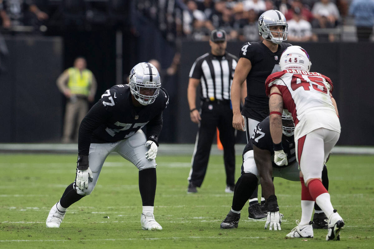Raiders offensive tackle Thayer Munford Jr. (77) and guard Lester Cotton Sr. (67) stay set as q ...