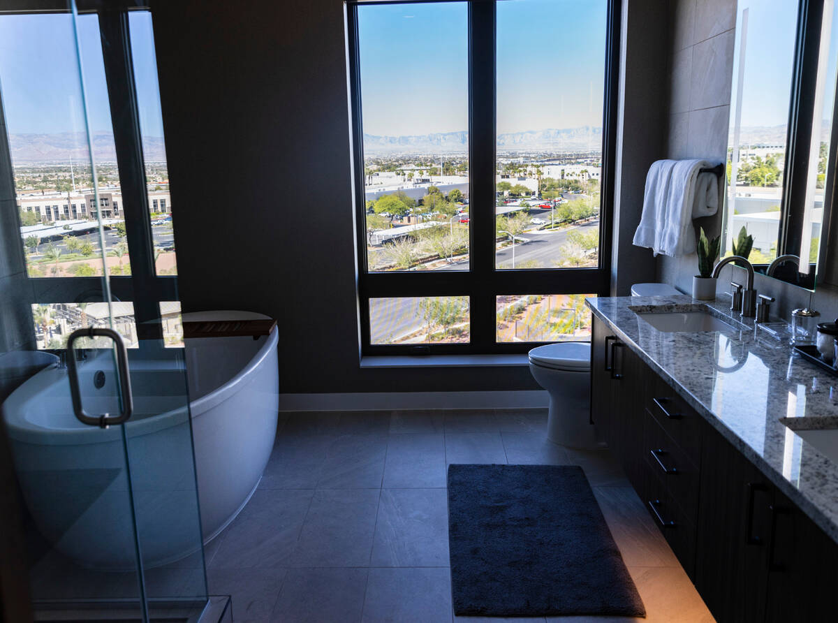 A bathroom inside a two bedrooms apartment at Life Time Living, a Luxury apartment building, ne ...