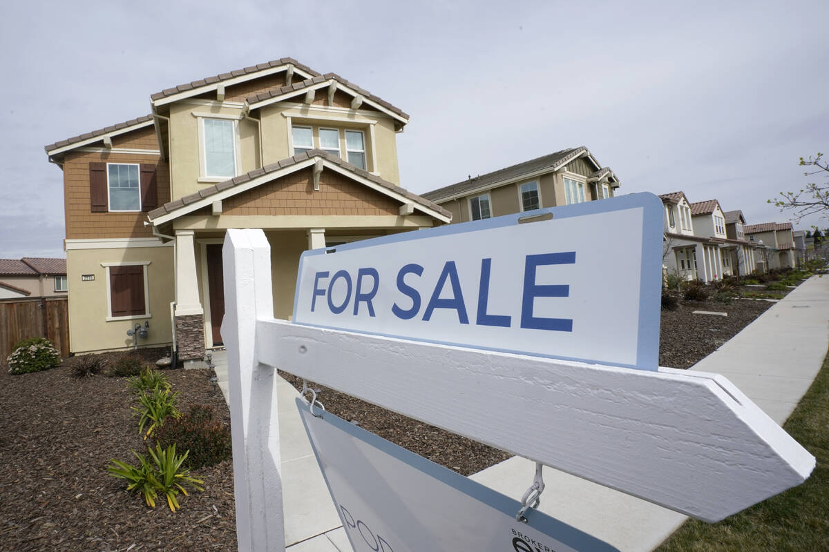 A for sale sign is posted in front of a home in Sacramento, Calif., Thursday, March 3, 2022. Th ...