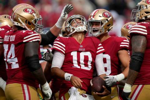 San Francisco 49ers quarterback Jimmy Garoppolo (10) celebrates with teammates during the secon ...