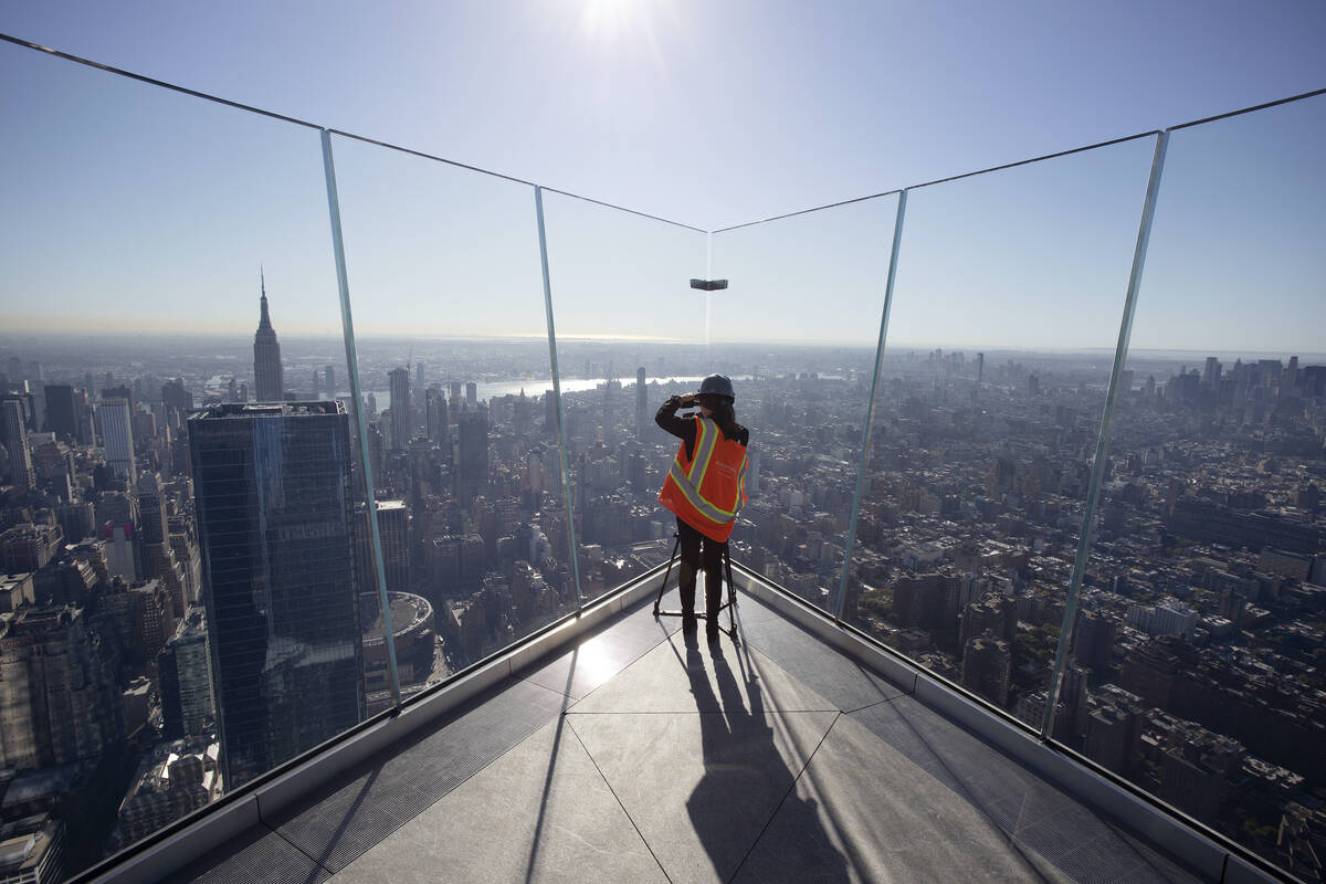 A videographer works on the "Edge," an outdoor observation deck at New York City's Hudson Yards ...