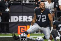 Raiders offensive lineman Jermaine Eluemunor (72) stretches before an NFL game at Allegiant Sta ...