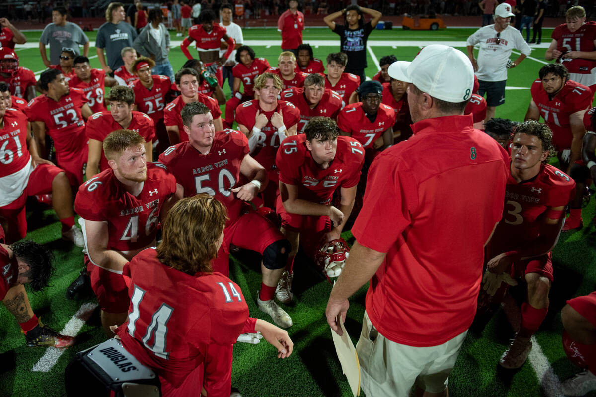 Arbor View High School huddles up after beating Snow Canyon 7-0 in the first game of the season ...