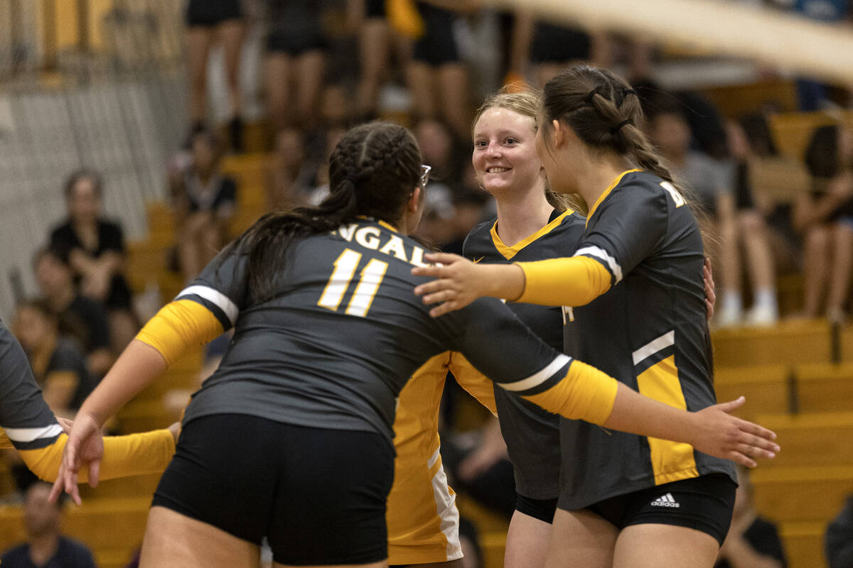 Bonanza’s Gaby Rose (11), Clara Jennings, center, and Hannah Judkins, right, celebrate a ...