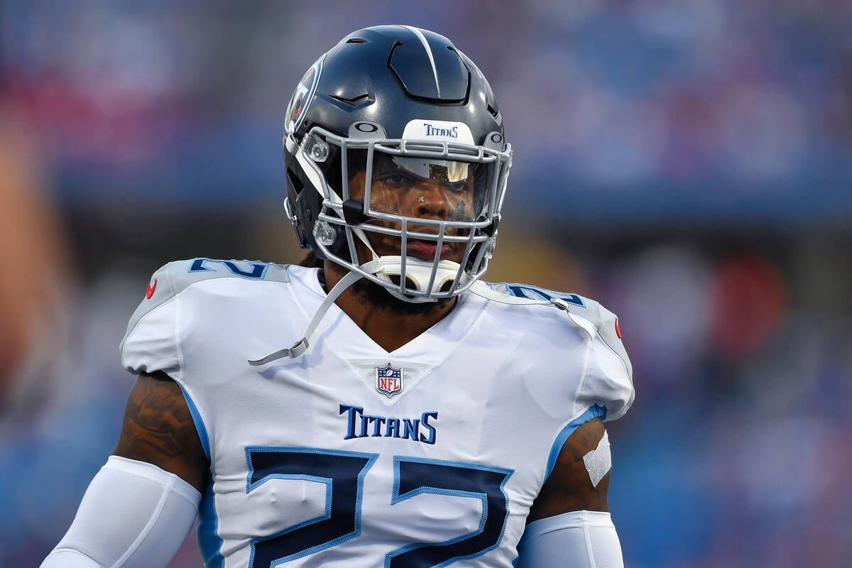 Tennessee Titans running back Derrick Henry warms up before an NFL football game against the Bu ...