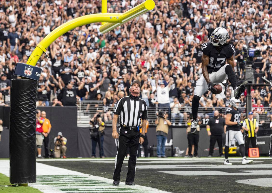 Las Vegas Raiders wide receiver Davante Adams (17) celebrates after scoring a touchdown against ...