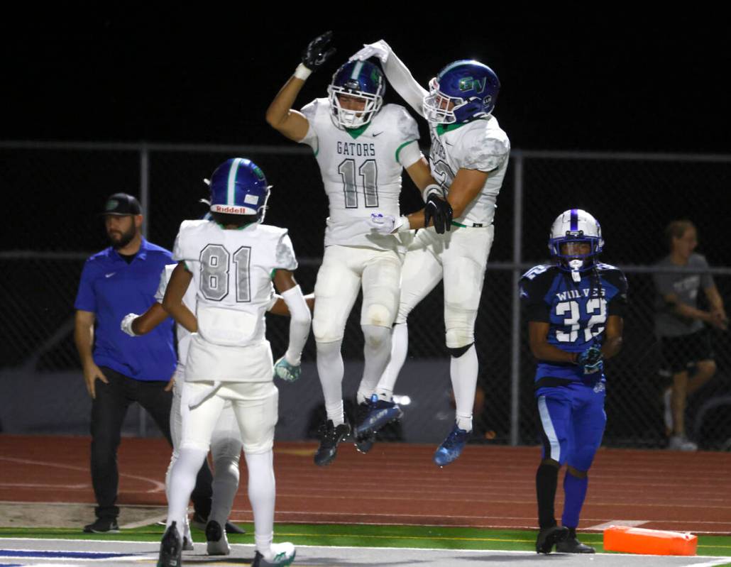 Green Valley High's wide receiver Nate Richter (11) celebrates his touchdown with his teammates ...