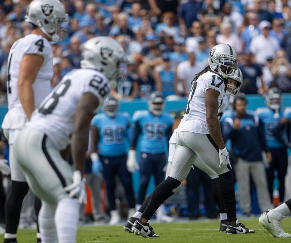 Raiders wide receiver Davante Adams (17) looks back from the line of scrimmage during the first ...