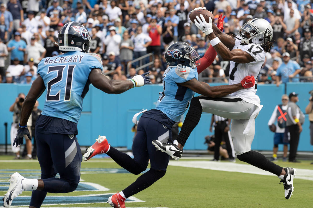 Raiders wide receiver Davante Adams (17) makes a touchdown catch over Tennessee Titans safety K ...