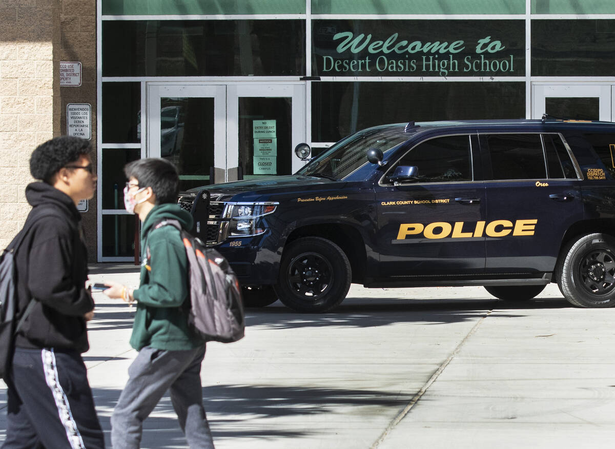 The Clark County School district police vehicle is seen as students at Desert Oasis High School ...