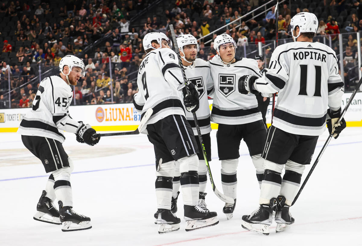 The Los Angeles Kings celebrate after defeating the Golden Knights in overtime in a preseason N ...